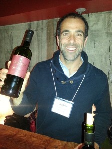 Wine maker Sebastian Labbe from Carmen holding a bottle of his Cabernet Sauvignon
