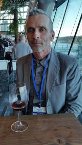 Randy Picton from Nk'Mip Cellars with a glass of his Pinot Noir