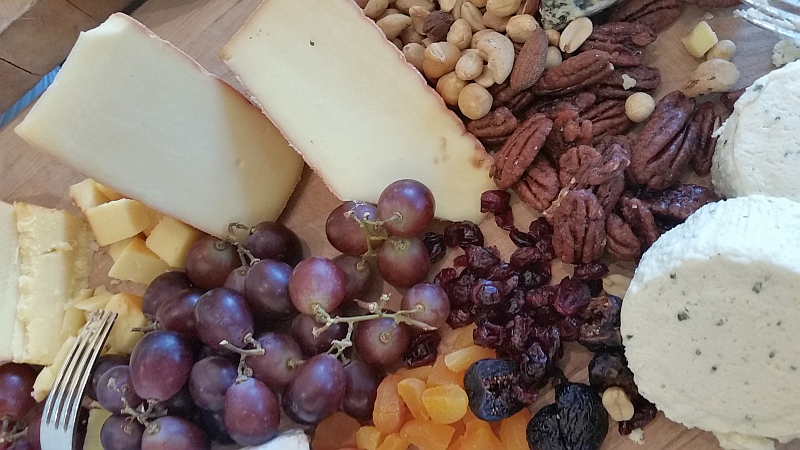 Cheese, grapes, and nuts to enjoy with a glass of wine