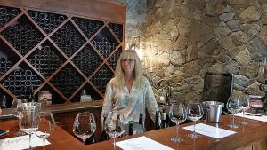 Debbie Woodward preparing to pour wines for us to taste at Privato Winery