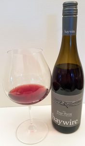 Haywire Free Form Pinot Noir 2015 with wine in glass
