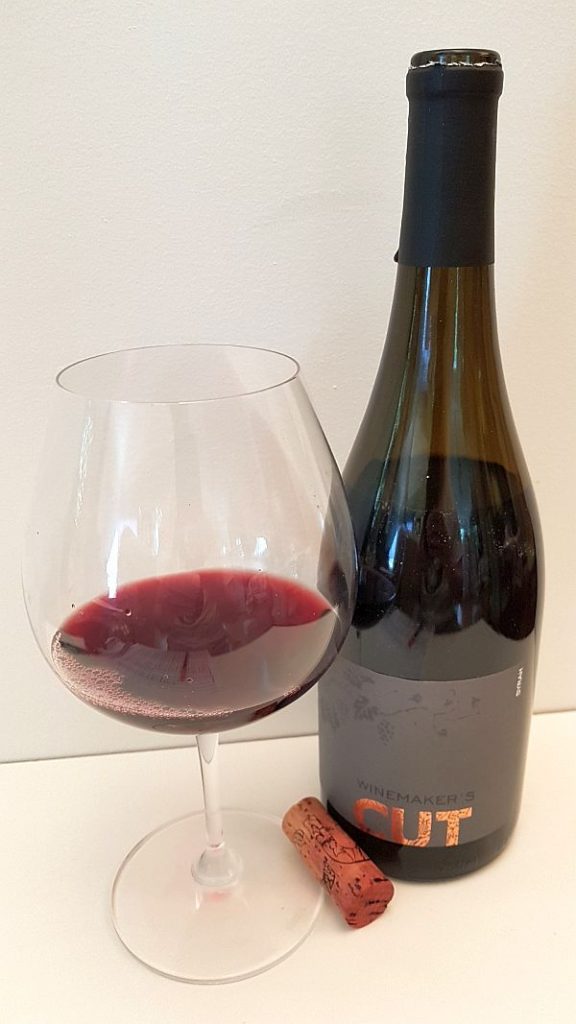 Winemaker's CUT Syrah 2016 with wine in glass
