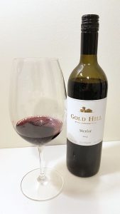 Gold Hill Merlot 2014 with wine in glass