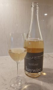 Haywire Vintage Bub 2013 with wine in glass