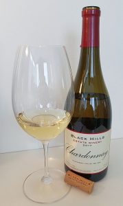 Black Hills Estate Winery Chardonnay 2017 with wine in glass