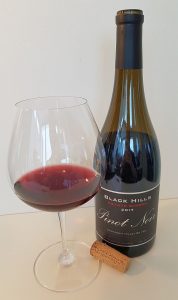 Black Hills Estate Winery Pinot Noir 2017 with wine in glass