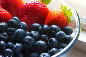 Strawberries and blueberries in bowl
