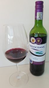 Two Oceans Shiraz 2018 with wine in glass