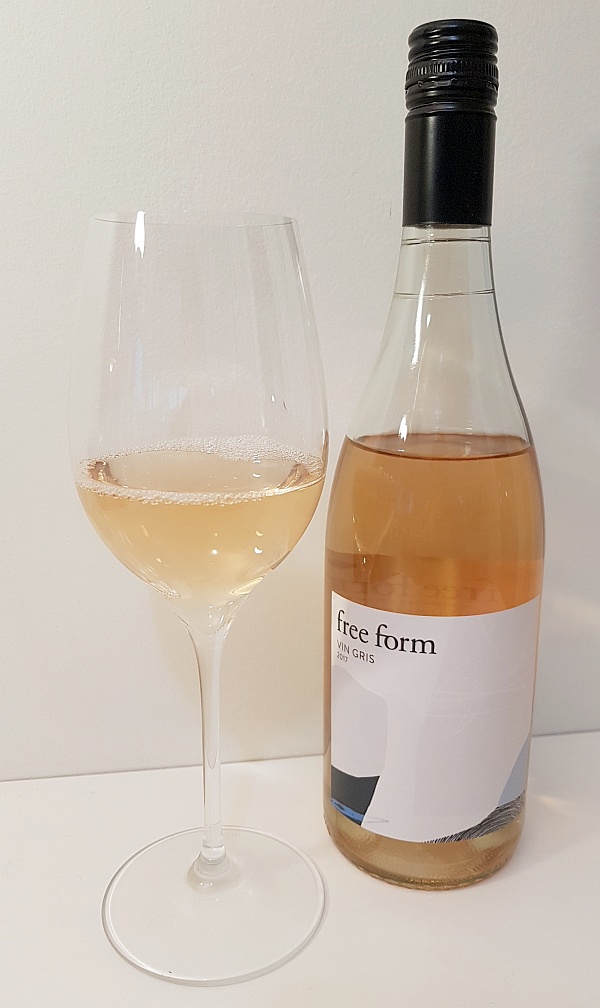 Okanagan Crush Pad free form Vin Gris 2017 with wine in a glass