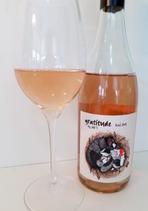 Gratitude by JAK's Rosé 2019 with wine in glass
