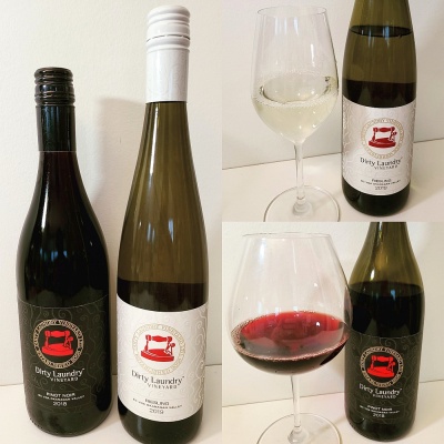 Dirty Laundry Riesling 2019 and Pinot Noir 2018 with wine in glass sm