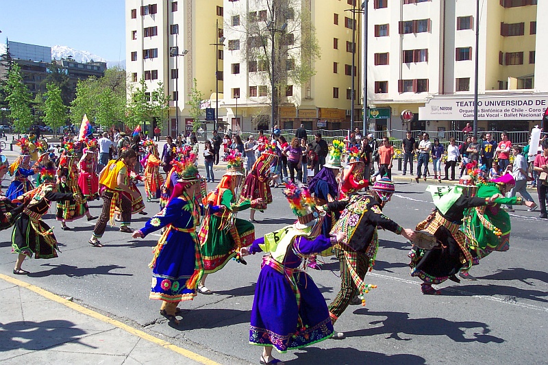 Costumed dancers parade in Santiago