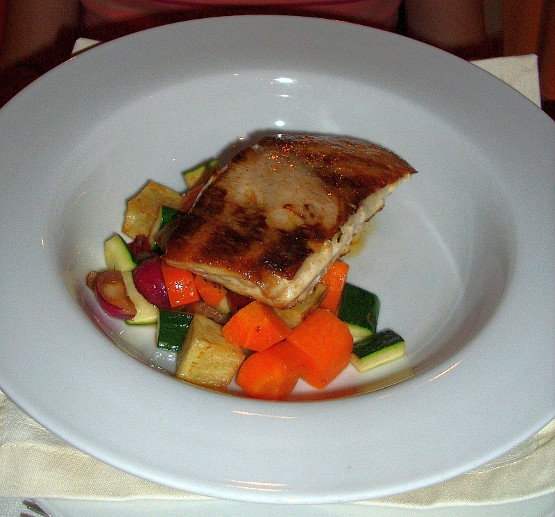 Grilled Chilean sea bass over vegetables