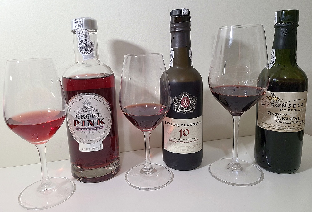 Croft Pink Port, Taylor Fladgate 10 Year Old Tawny Port, and Fonseca Quinta do Panascal Vintage Port 2005 with wines in glasses