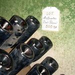 Champagne bottles in a riddling rack