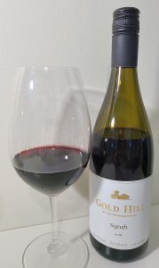 Gold Hill Syrah 2016 with wine in glass