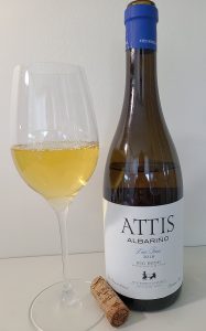Attis Albariño Lias Finas 2018 with wine in glass