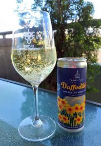 Seaside Pearl Daffodils To Go Sparkling Wine 2019 in glass on the patio