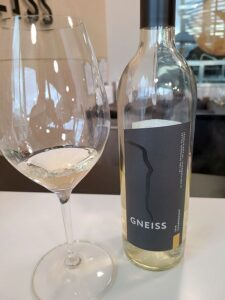 Gneiss Wines Chardonnay 2019 with wine in glass