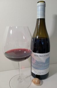 Blue Mountain Vineyard and Cellars Estate Cuvee Pinot Noir 2019 with wine in glass