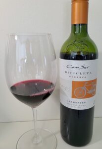 Cono Sur Bicicleta Reserva Carmenere 2020 with wine in glass