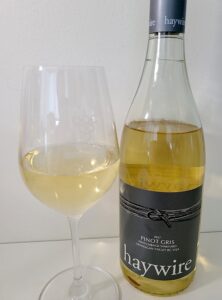 Haywire Switchback Vineyard Pinot Gris 2017 with wine in glass