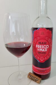 Masi Fresco di Masi Rosso Verona IGT 2020 with wine in glass