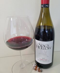 Stag's Hollow Winery Simply Noir 2020 with wine in glass