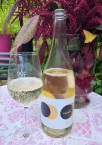 Moon Curser Vineyards Moonlit 2021 with wine in glass
