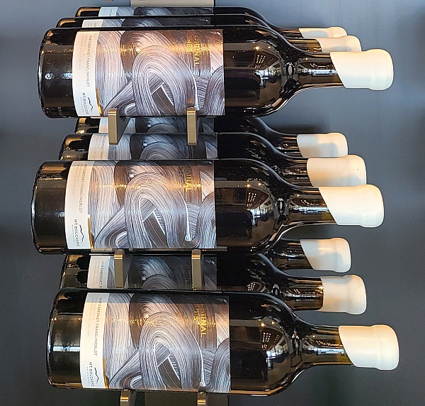 How to Open a Wax Capped Wine Bottle Video Wax capped wine bottles in a rack at Mt. Boucherie Estate Winery