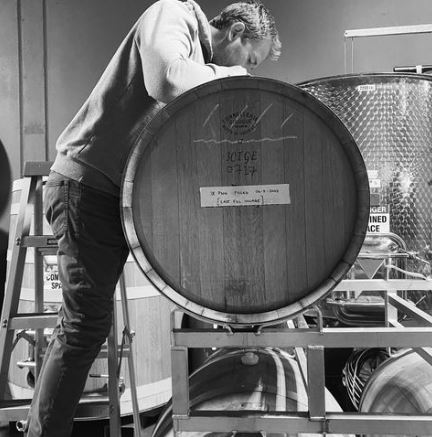 Ben Bryant at 1 Mill Road inspecting a wine barrel (Image courtesy 1 Mill Road)