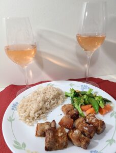Crispy pork belly, stir fried vegetables and rice paired with Saintly Rose wines