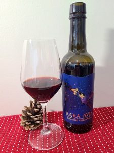 Rara Avis Fortified Haskap Wine with wine in glass