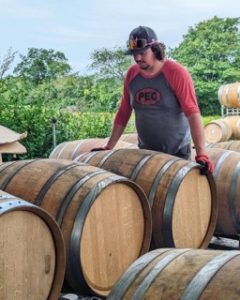 With the wine barrels at Rosehall Run Vineyards at harvest