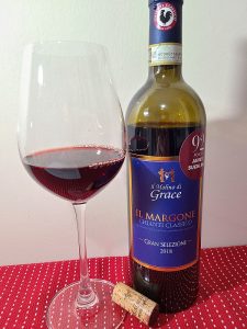 Il Molino di Grace Il Margone Chianti Classico Gran Selezione 2018 with wine in glass
