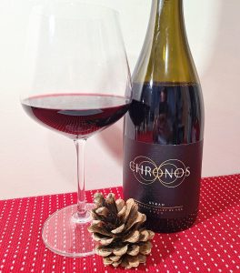 TIME Family of Wines Chronos Syrah 2020 with wine in glass