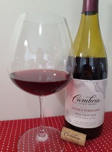 Cambria Estate Winery Julia’s Vineyard Pinot Noir 2022 with wine in glass