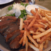 Striploin steak frites with a Brandy peppercorn sauce