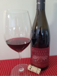 Hester Creek Grenache Syrah Mourvedre 2022 with wine in glass