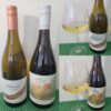 Featherstone Estate Winery Unoaked Chardonnay 2023 and The Grange of Prince Edward, Victoria Block, Chardonnay 2024 with wines in glasses