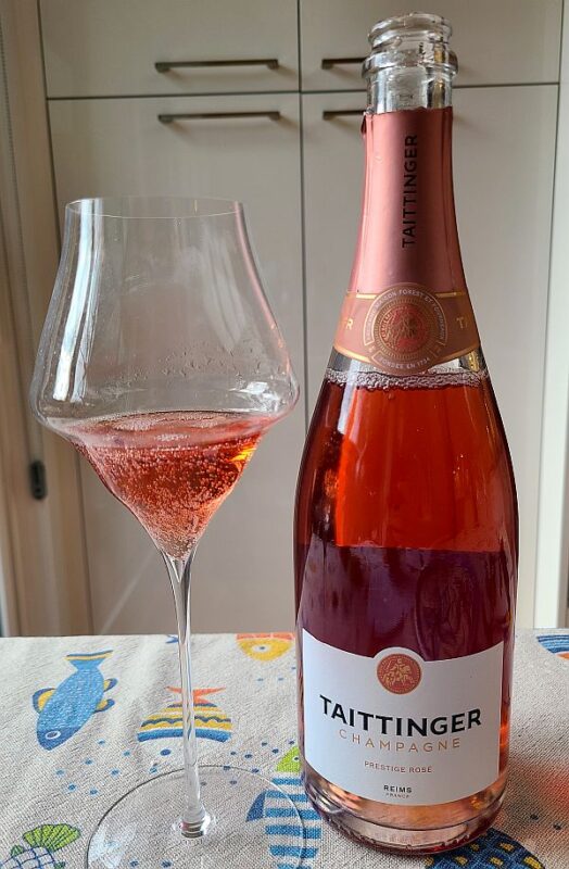 Champagne Tattinger Prestige Rosé, NV with wine in glass