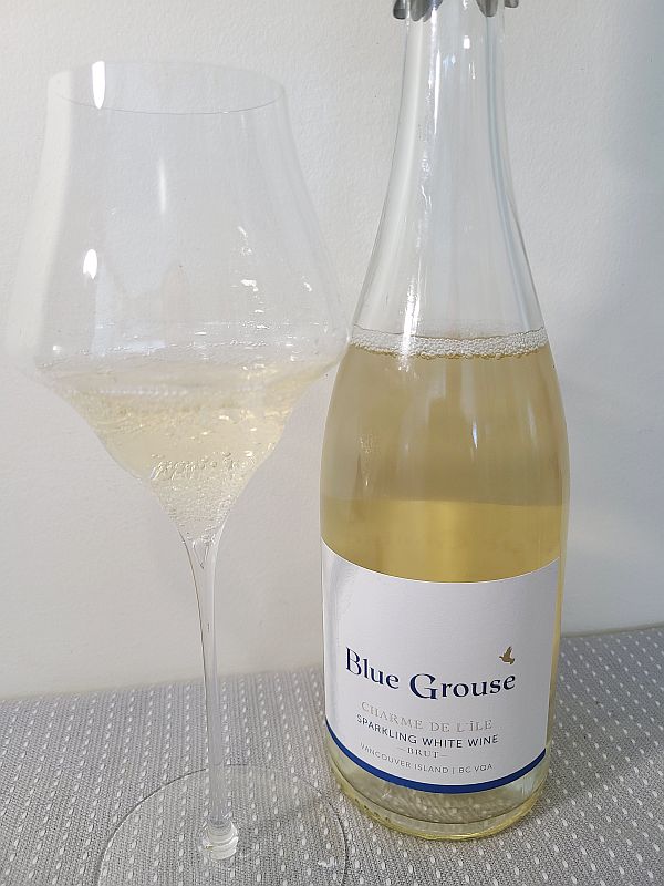 Blue Grouse Estate Winery Charme de l'ile Sparkling White Wine Brut with wine in glass