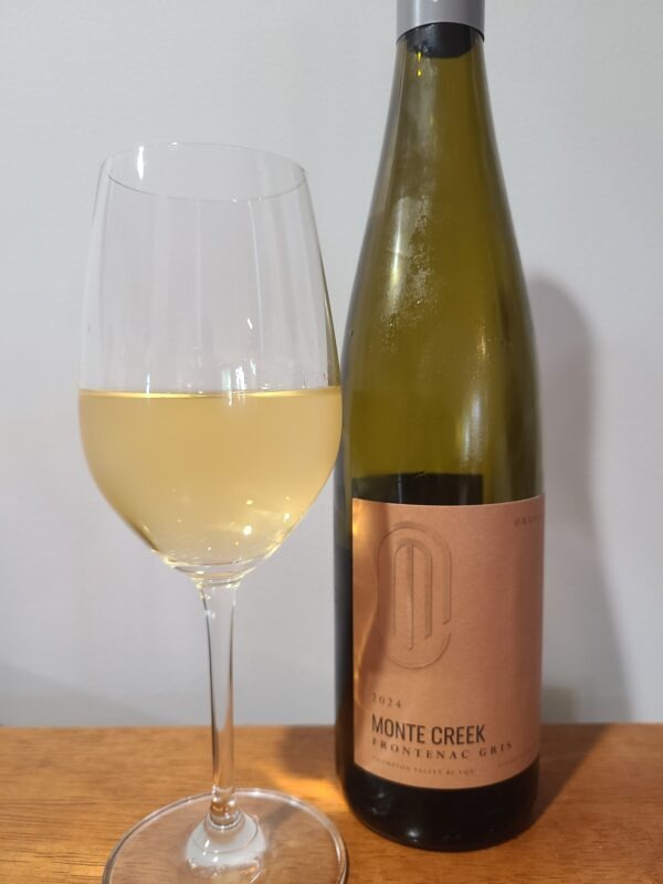 Monte Creek Winery Frontenac Gris 2024 with wine in glass