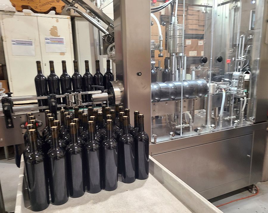 Labelling wine and adding capsules at Chaberton Estate Winery
